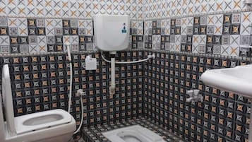 Bathtub, slippers, towels, soap