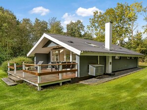 A modern house with a deck, a chimney, and a garden. - "Dimo" - 30km from the sea by Interhome (Toftlund)