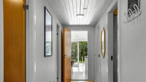 A modern hallway with a wooden floor, white walls, and a ceiling with linear lighting. - "Dimo" - 30km from the sea by Interhome (Toftlund)