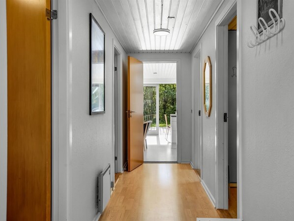 A modern hallway with a wooden floor, white walls, and a ceiling with linear lighting. - "Dimo" - 30km from the sea by Interhome (Toftlund)