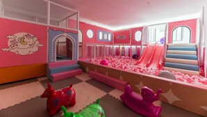 A children's play area with a ball pit, slides, and soft play structures. - Benedictions Homes (Nairobi)