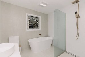 Shower, hair dryer, towels, shampoo