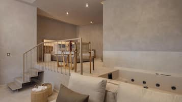 Luxury Room, Hot Tub | Living area | 43-inch Smart TV with cable channels