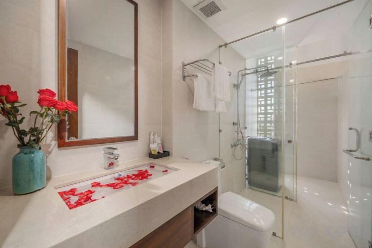 Shower, rainfall showerhead, designer toiletries, hair dryer