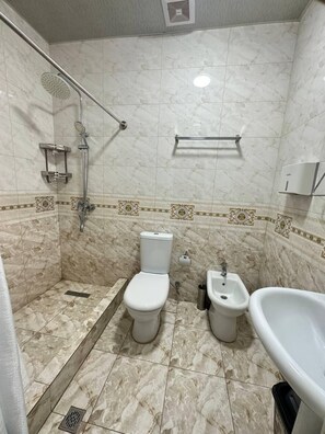 Hair dryer, slippers, towels, soap