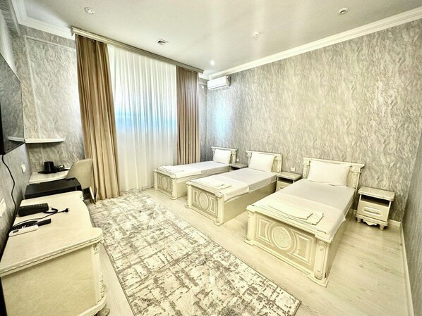 Comfort Triple Room, City View | Premium bedding, desk, laptop workspace, free rollaway beds - Almir Hotel (Tashkent)