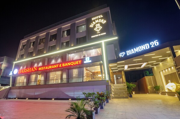 A hotel named "Hotel Diamond 26" with a "Darshan Restaurant & Banquet" on the ground floor.