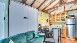 A compact kitchen with a refrigerator, microwave, and wooden cabinets. - 7 Mi to Dtwn: Studio w/ Screened Porch in Tampa (Tampa)