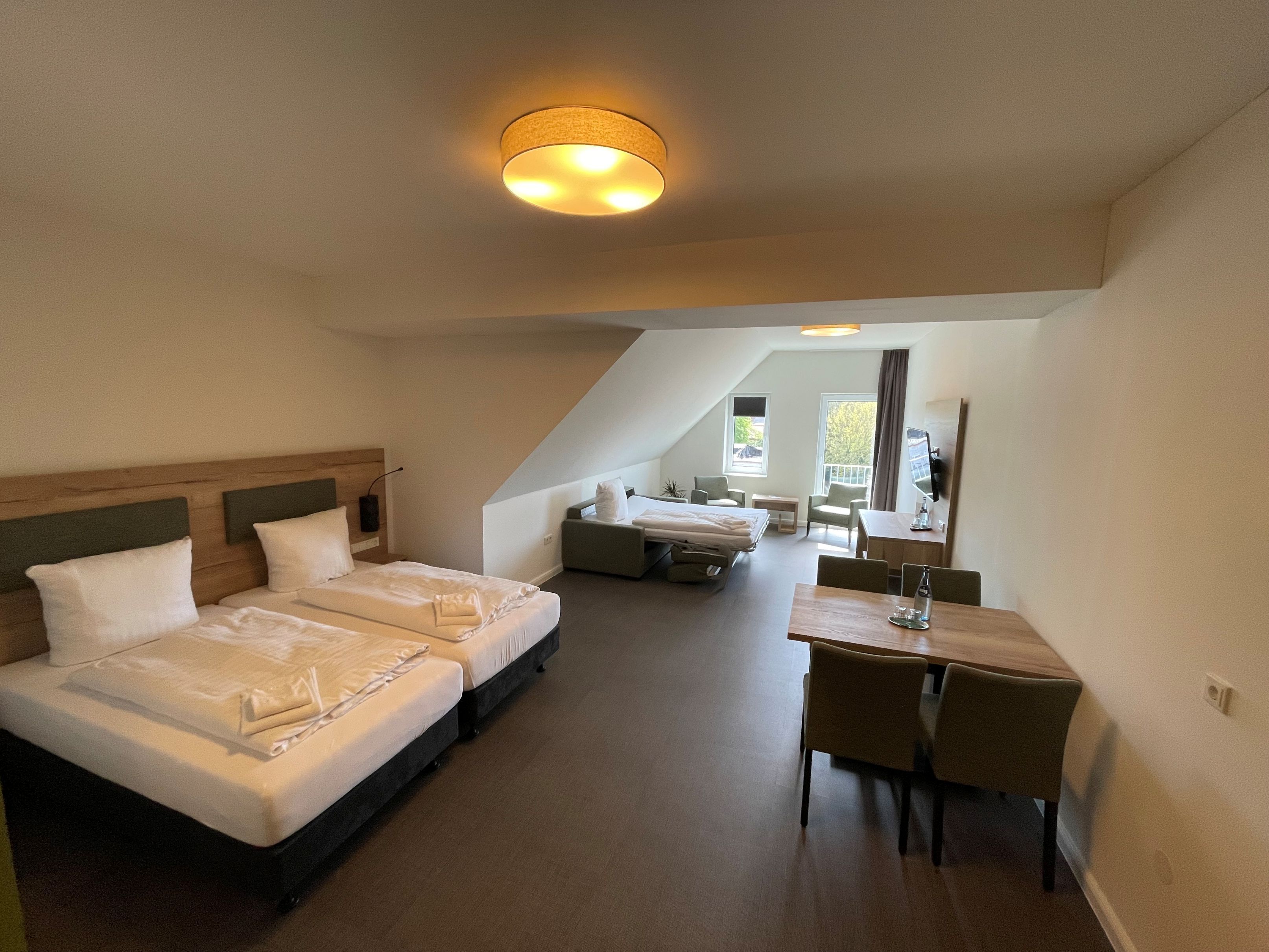 Family Quadruple Room, 1 Queen Bed with Sofa bed, Non Smoking, City View | Desk, laptop workspace, blackout drapes, soundproofing