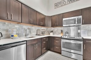 Fridge, microwave, oven, stovetop - Charming Home w/ Cozy Porches, Courtyard, and Parking by Lucky Savannah (Savannah)