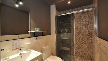 Superior Triple Room, Courtyard View | Bathroom | Shower, hair dryer, slippers, towels