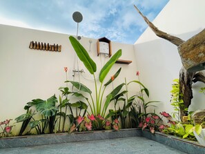 Triple Room, Air conditioning, Pool View | Bathroom | Shower, hair dryer, slippers, towels - Hang Sói Forest Village (Ho Chi Minh City)