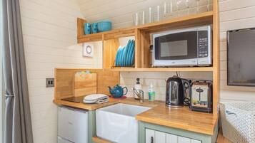 Fridge, microwave, cookware/dishes/utensils