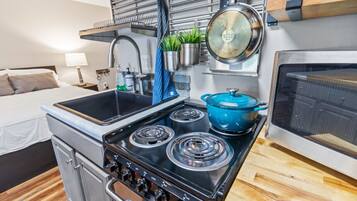 Fridge, microwave, stovetop, coffee/tea maker