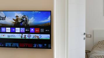 1 habitación, tabla de planchar con plancha, cuna de viaje y wifi