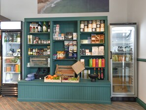 A grocery display with various food items and beverages.