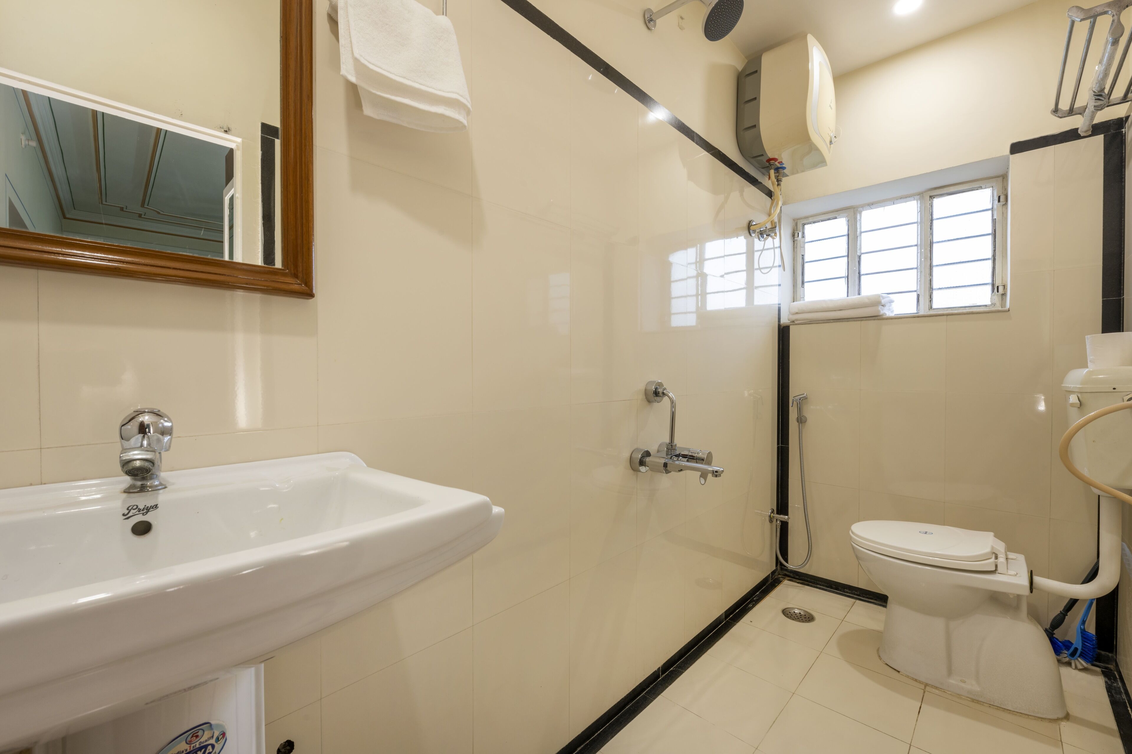 A bathroom with a sink, toilet, and shower.
