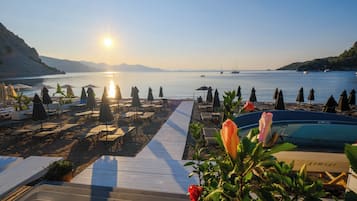 Private beach, free beach cabanas, beach shuttle, sun loungers