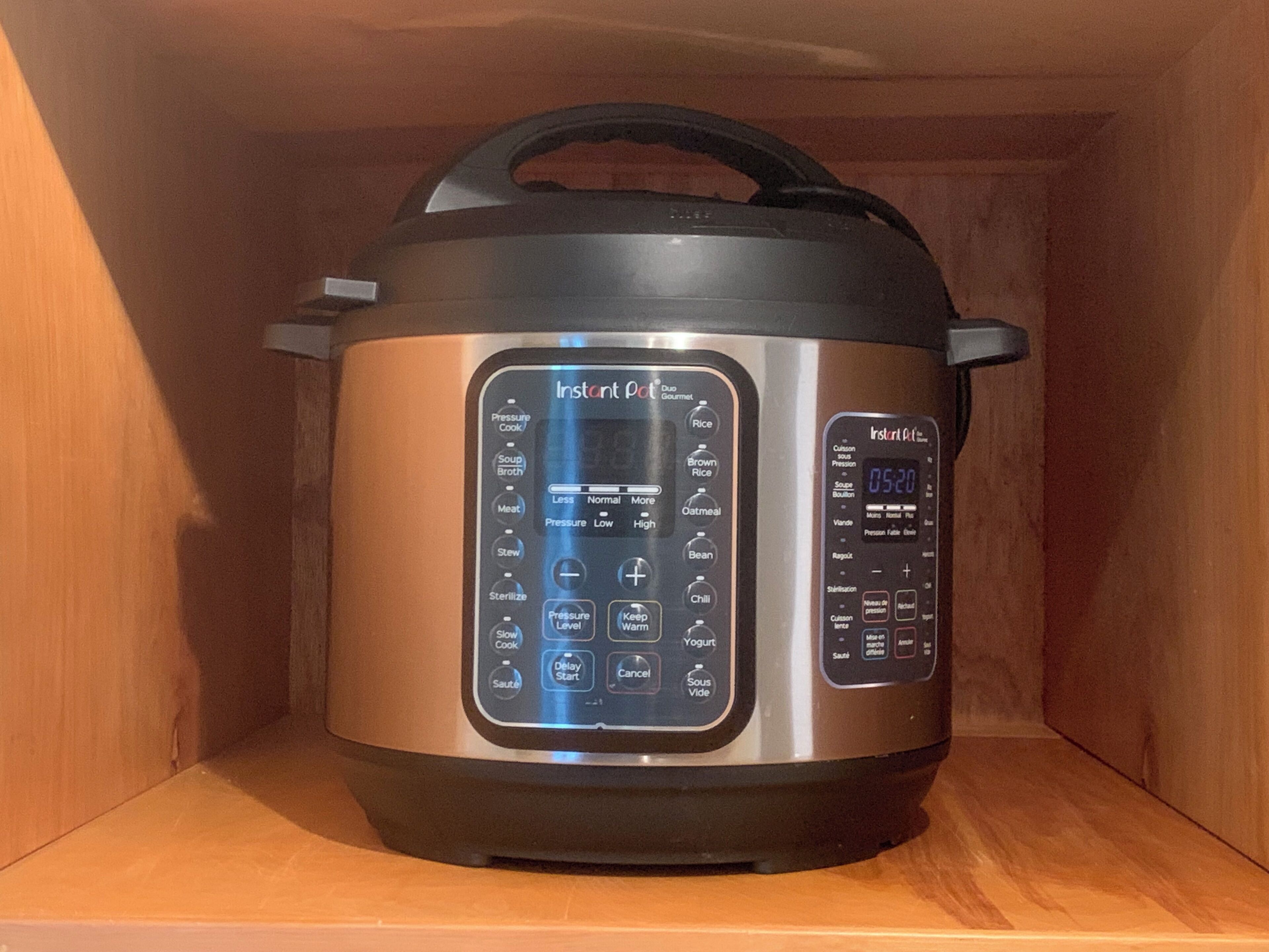 An Instant Pot with a digital display and multiple cooking settings.