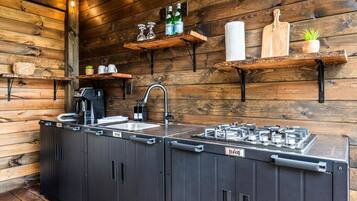 Fridge, microwave, coffee/tea maker, cookware/dishes/utensils