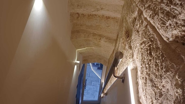A staircase with stone walls and modern lighting fixtures. - La Casetta (Mola di Bari)