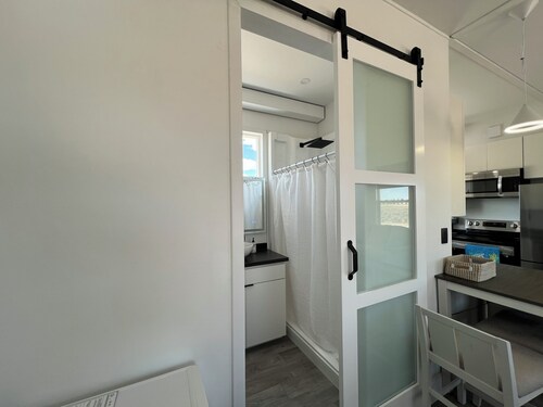 Cozy Beach House tiny home in tranquil Beryl Utah with AC, WiFi, fitness room.