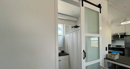 Cozy Beach House tiny home in tranquil Beryl Utah with AC, WiFi, fitness room.
