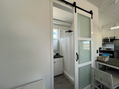 Cozy Beach House tiny home in tranquil Beryl Utah with AC, WiFi, fitness room.