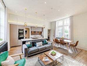 A modern apartment with a living room, dining area, and kitchen. - Upstairs is a stylish duplex apartment oozing luxury accommodation throughout. (Clitheroe)