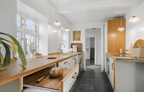 Fridge, stovetop, dishwasher, coffee/tea maker