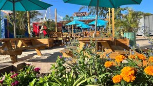 A beachside restaurant with outdoor seating and large umbrellas. - The Lotus Room, Carlisle Bay, Eden On The Sea  (Bridgetown)