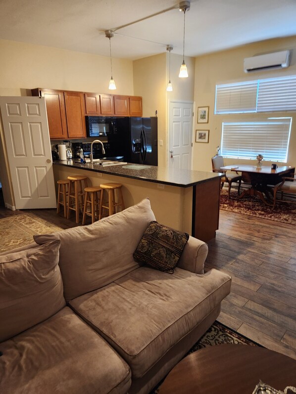 Enjoy a comfortable stay in this well-appointed living space with a kitchen, dining area, and cozy seating area.