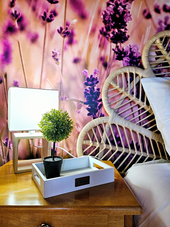 A wooden bedside table with a small potted plant, a white tray, and a whiteboard. - La Grange Padirac (Padirac)