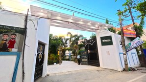 A gated entrance with a sign for a restaurant named "Mantra." - THE MANTRA A LUXURY BOUTIQUE HOTEL (Patna)
