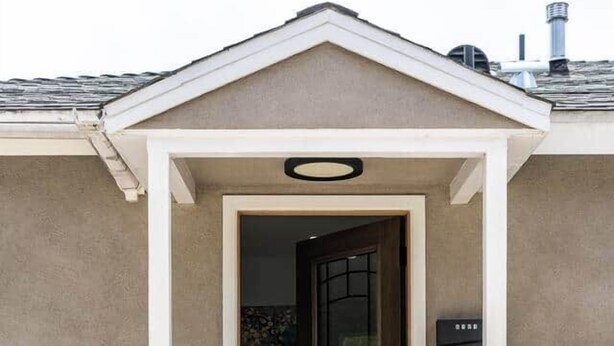 A house entrance with a brown door, a white porch, and a mailbox. - Adorable House with EV&Parking-Family Friendly (Culver City)