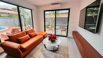 Executive Suite, 1 Bedroom, Balcony, Pool View | Living area | Smart TV