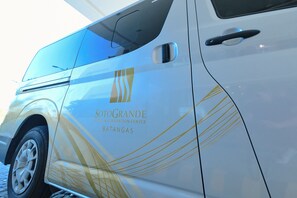A white van with the text "SOTOGRANDE HOTEL & CONVENTION CENTER BATANGAS" on its side.