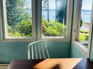 A room with a view of a lake and greenery through a window. - 4 Person Holiday Home in Onsala (Gottskar)