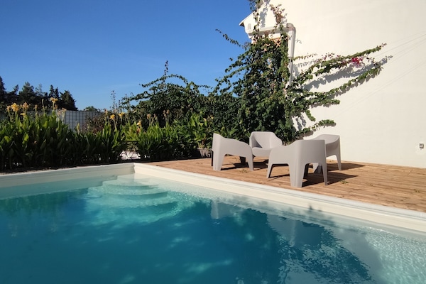Outdoor pool, open 10:00 AM to 6:00 PM, pool umbrellas, pool loungers