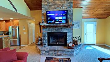 Smart TV, fireplace, DVD player, books