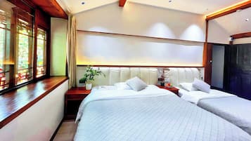 Family Triple Room, Courtyard View | Individually decorated, individually furnished, laptop workspace