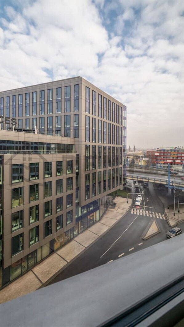 A modern building with a glass facade and a flat roof.