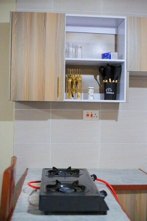 Fridge, microwave, stovetop, electric kettle - Perfect Getaway: Quiet, 1-Bedroom Private Balcony. Walk to Kisumu Airport. (Kisumu)