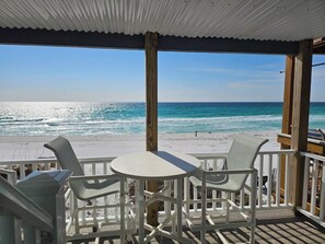 A covered outdoor seating area with a view of the beach and ocean. - 12 - 3BR $700+ in freebies incl golf, On Beach (Miramar Beach)