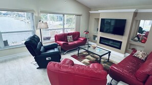 Smart TV, fireplace, books, printers