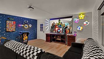 Älytelevisio, takka, videopelejä, pöytäjalkapallopöytä