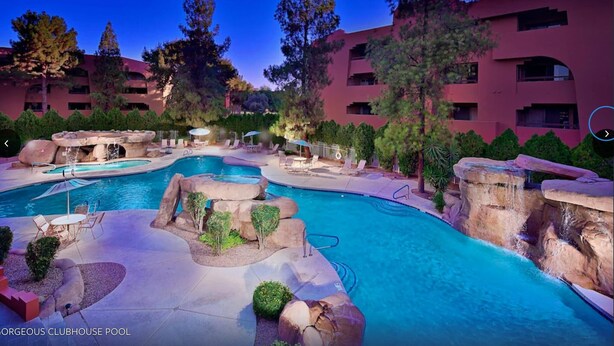 A large, multi-pool outdoor area with rock formations and lounge seating. - CASA FAMILIA - 1st floor 2-bedroom unit (Phoenix)