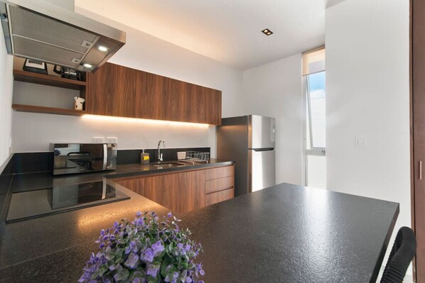 Fridge, microwave, stovetop, coffee/tea maker