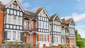 A row of Victorian-style houses with bay windows and brick facades. - Sea to Sea, Hythe Kent (Hythe)