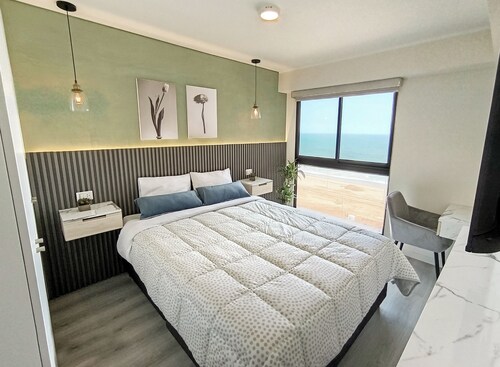 Luxury Oceanfront Suite with Stunning Views, Fully Furnished and Modern